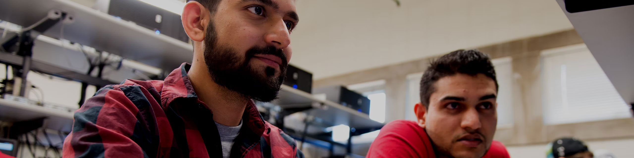 Students looking to a computer screen.